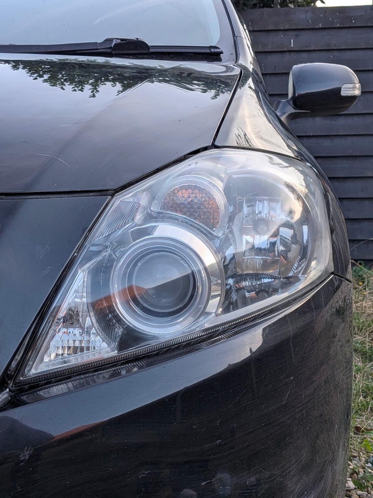 Toyota Auris headlight after restoration — crystal clear lens with chrome reflector detail